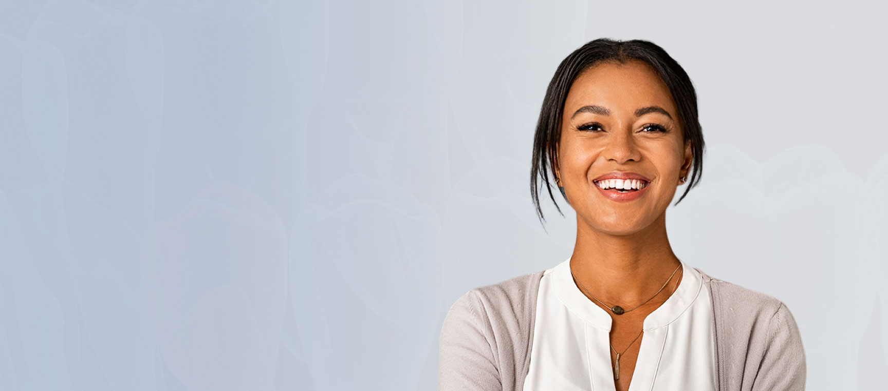 Radiant woman confidently smiling and showcasing her beautiful teeth.